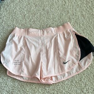 Peach and black Nike shorts